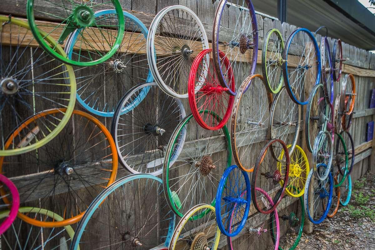 Fence with bike wheels nailed to it